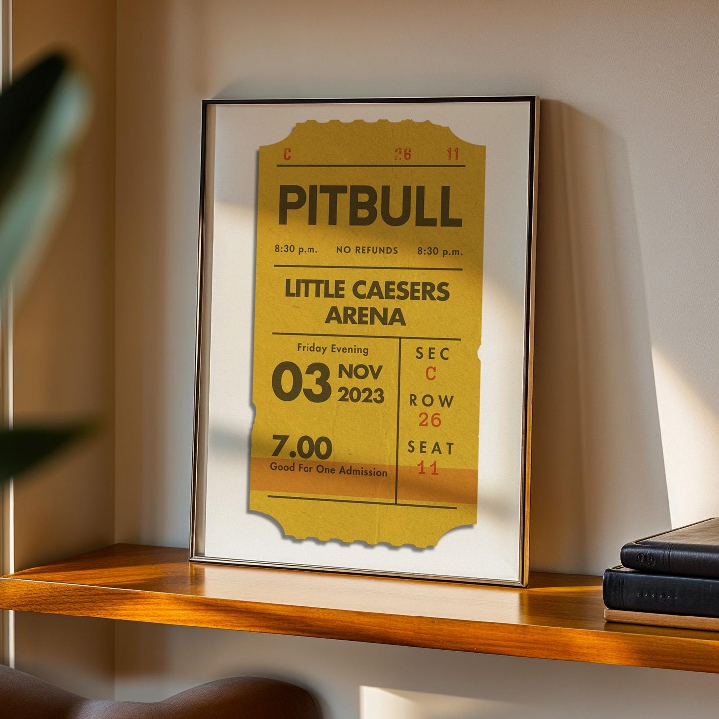 Custom framed art concert ticket print leaning on shelf, digital vintage-style keepsake, personalised single ticket design.
