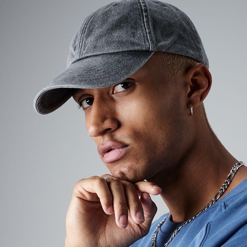 worn baseball hat with pint embroidery, a stylish nod to drinking culture.