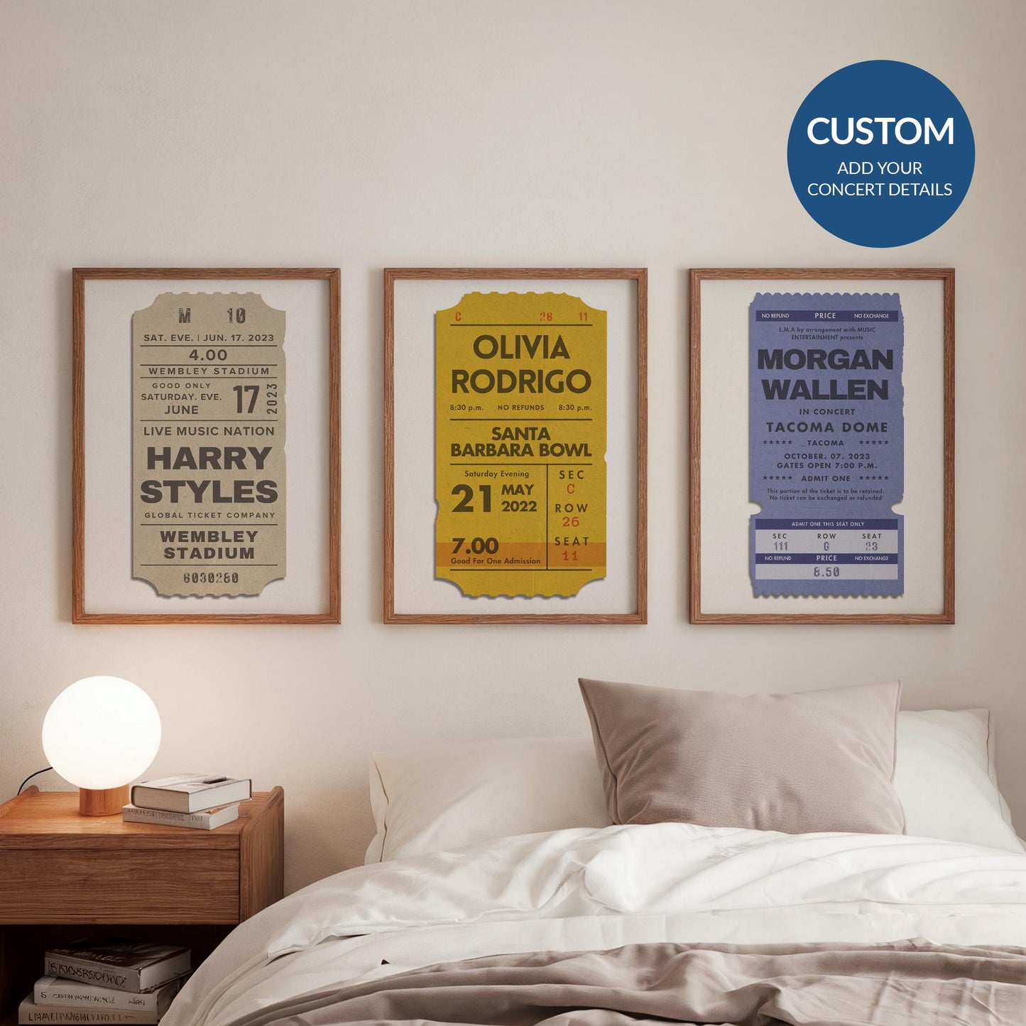 Framed bundle of 3 concert ticket posters, personalised set in beige, mustard yellow, and cool blue. set of 3 on a wall above bed.