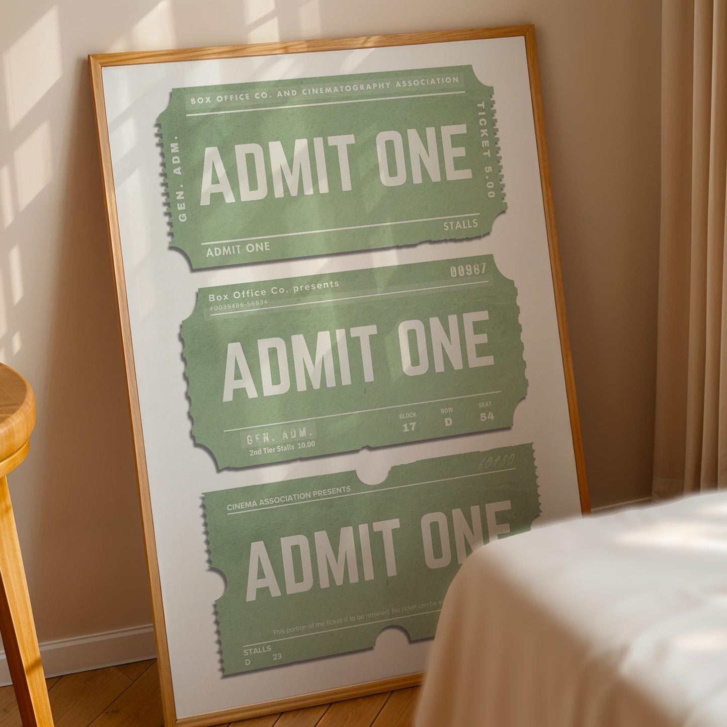 a framed art piece in the bedroom. a green old ticket theme on the poster