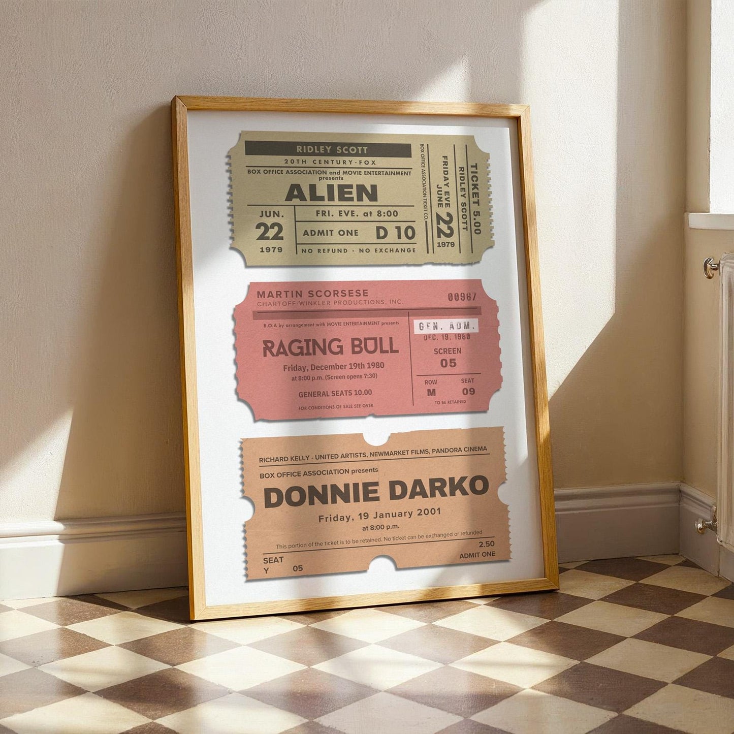 framed art leaning on wall in kitchen featuring popular movies