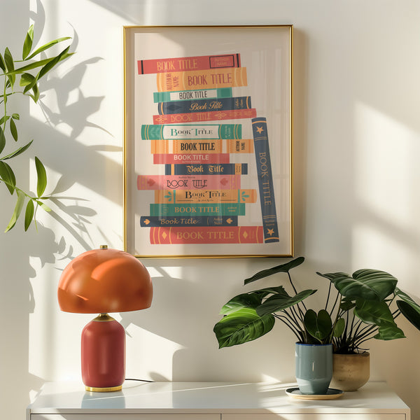 A custom made book stack art piece framed and in a bedroom of bookish reader decor in vintage colours.