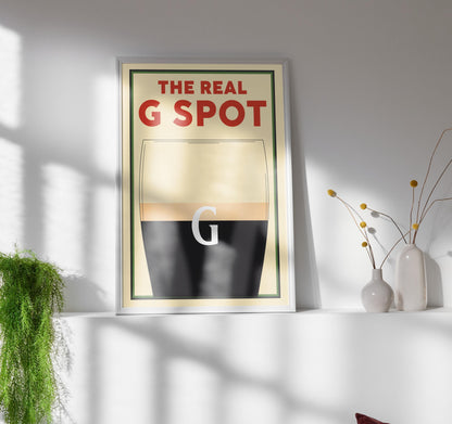A Vintage poster featuring a pint with the text above saying The Real G spot in reference to splitting the G. This is a perfect funny gift idea for any beer lovers or boyfriends and dads.
