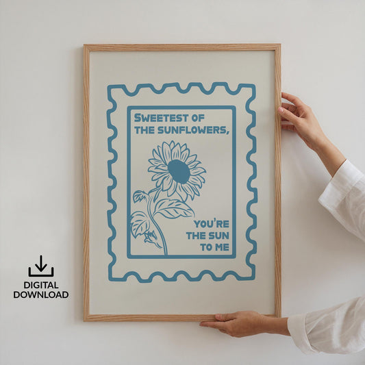 Digital download country lyric poster with sunflower art and stamped edge being held up, easy and quick printable file.