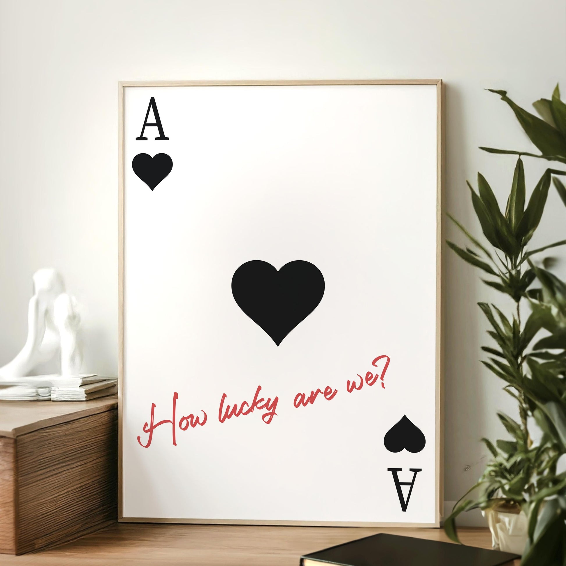 Cowboy-inspired black wall art featuring subtle black hearts and a red handwritten country lyric leaning on desk