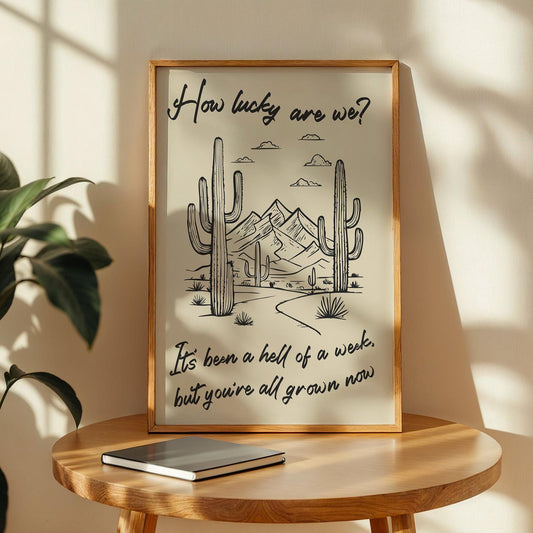Country western lyric poster with desert background and “how lucky are we?” lyrics, ideal wall art for rodeo lovers.