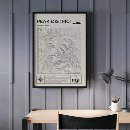Framed Peak District walking trail poster hung on wall, ideal gift for outdoor enthusiasts.