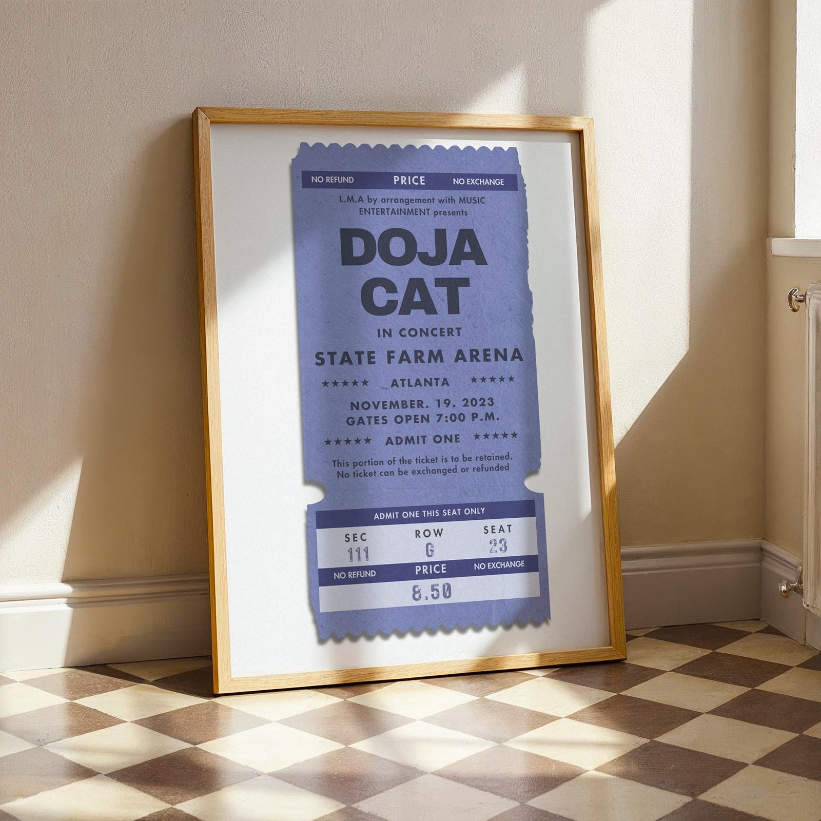 Personalised framed ticket print in cool blue, bespoke concert poster leaning on wall.