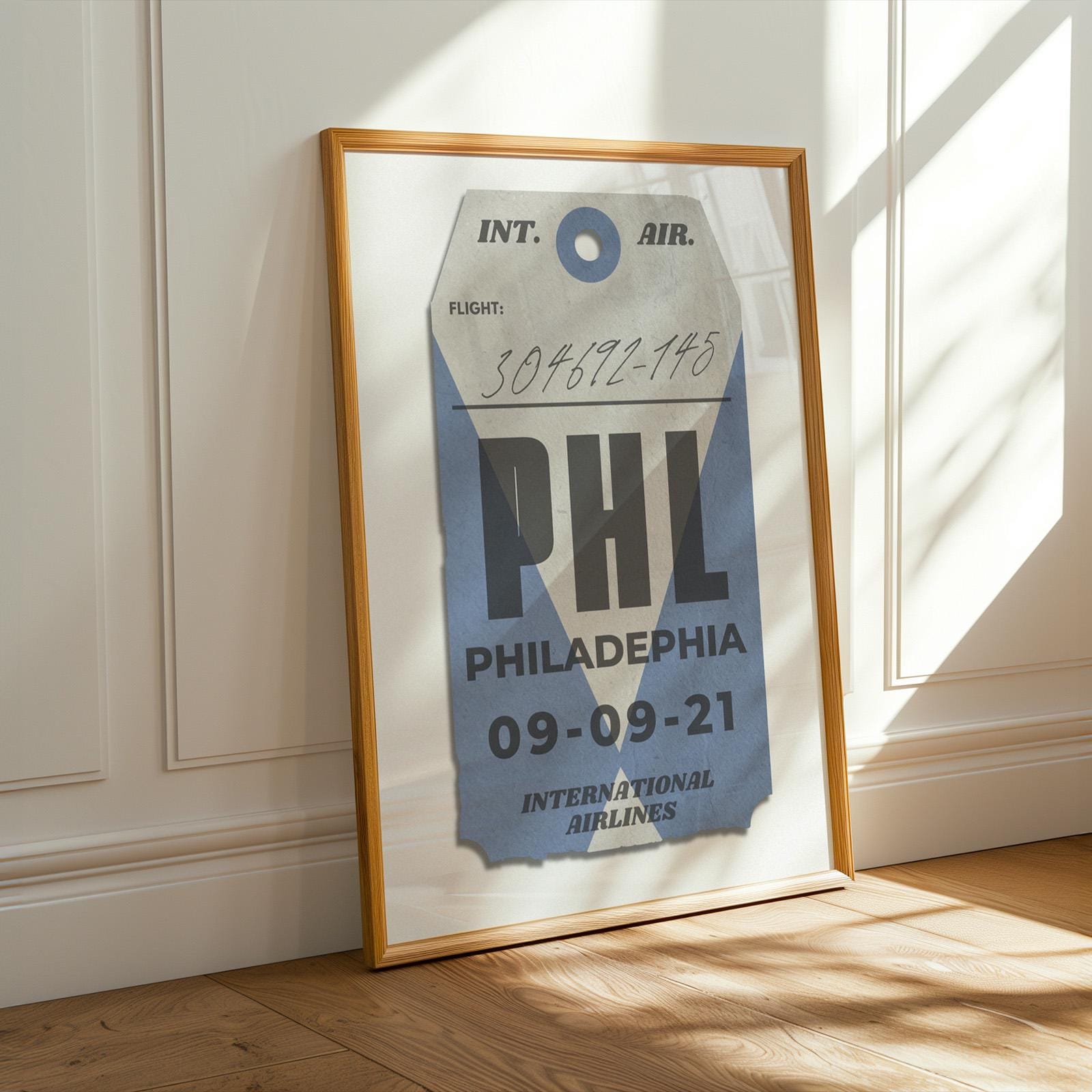 Blue luggage tag digital poster leaning on shelf, bespoke and personalised travel gift for holiday flights and memories.