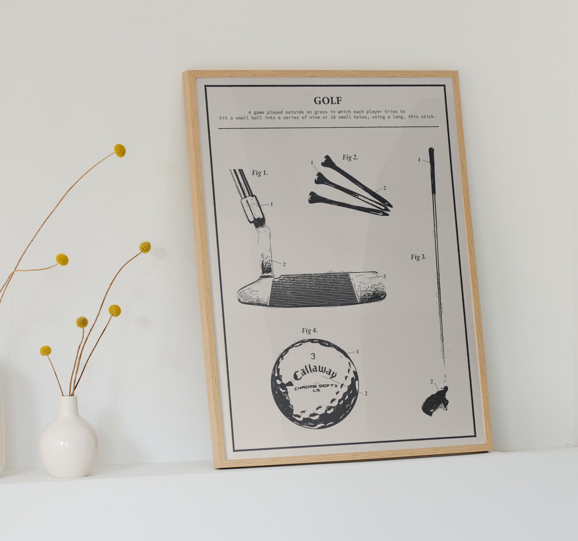 Framed rustic golf patent poster leaning on countertop, featuring detailed golf club, ball, and tee illustration in classic black and white.