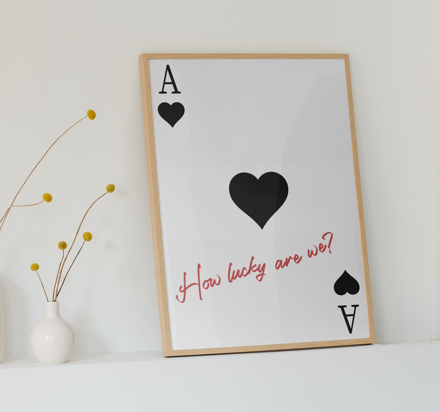 Black country-style poster with black hearts and a red romantic lyric casually displayed on a white surface