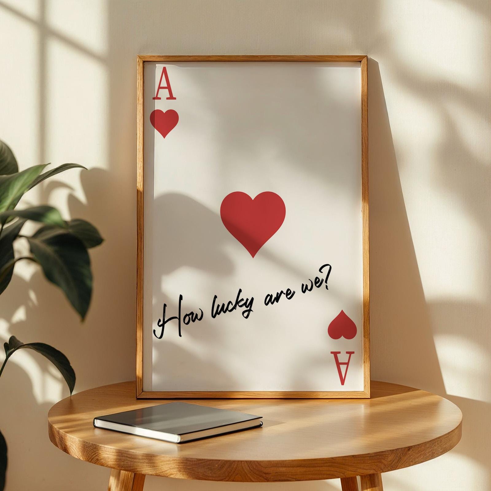 Framed red ace of hearts poster with the quote “How lucky are we?”. A romantic Western-style gift idea.