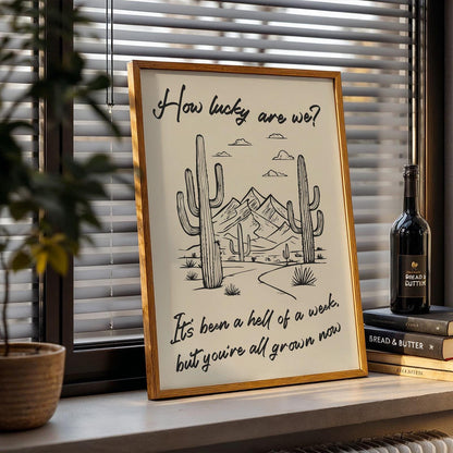 Western cowboy digital lyric print with desert illustration, “how lucky are we?” phrase, great music musician wall art.