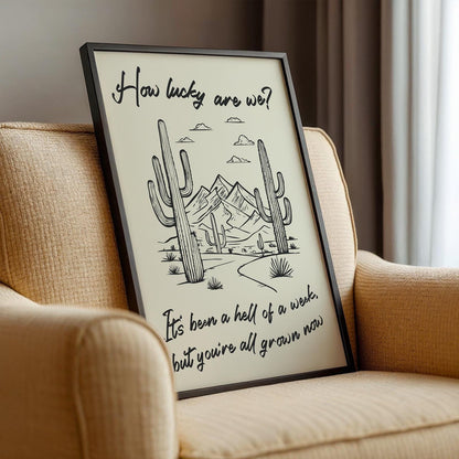 Rustic desert-themed print featuring lyric text, perfect gift for country and rodeo fans. Framed leaning on sofa
