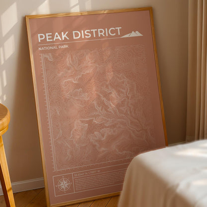 Peak District topographic poster framed, leaning on floor in bedroom, ideal outdoor adventure decor.