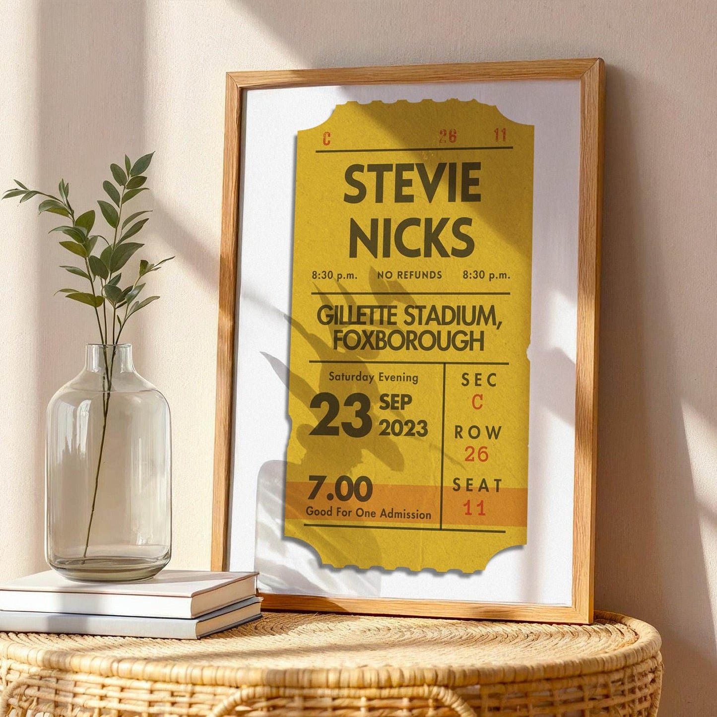 Framed custom ticket artwork in mustard yellow, physical vintage-style keepsake for music lovers.