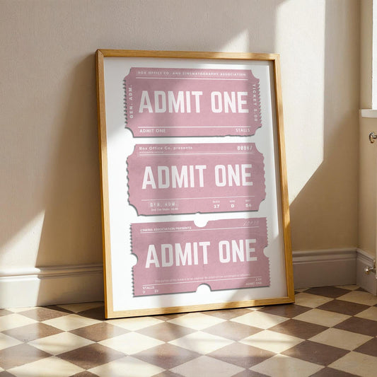 stylish pink ticket stub poster leaning on wall in kitchen