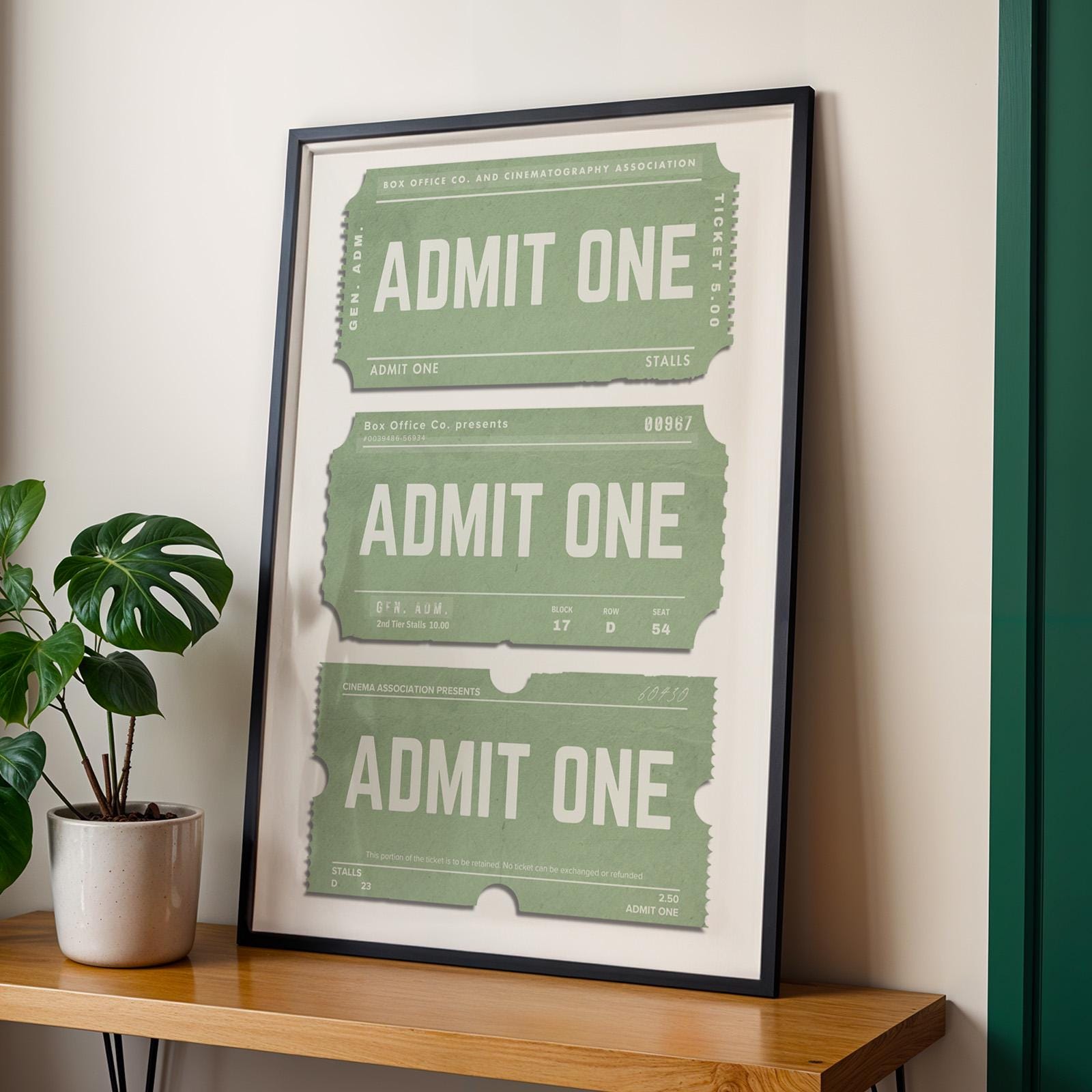 a black framed A3 poster with entry admission text on it on a access boarding pass vintage stub.