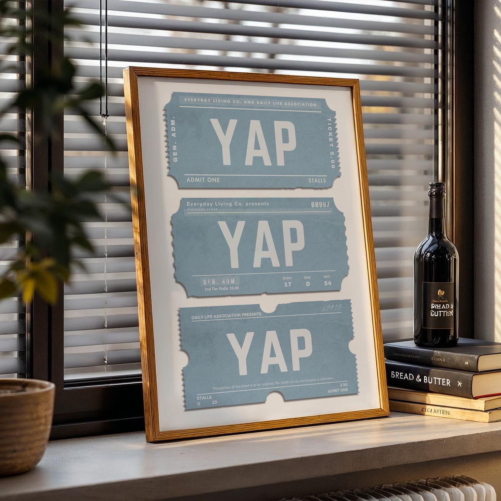 A large poster with funny saying leaning on window sill