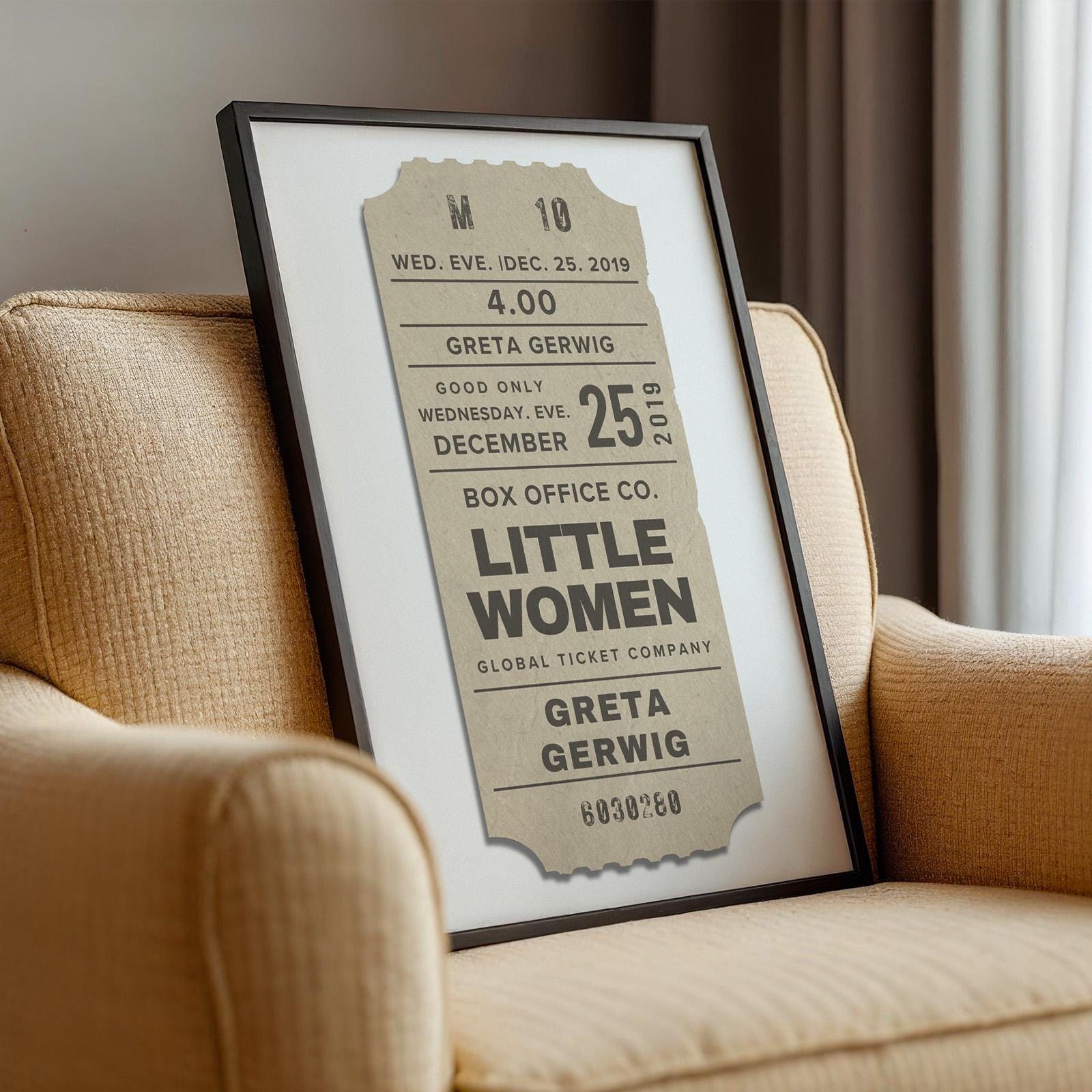 neutral colour designed cinematic event ticket style wall art on chair