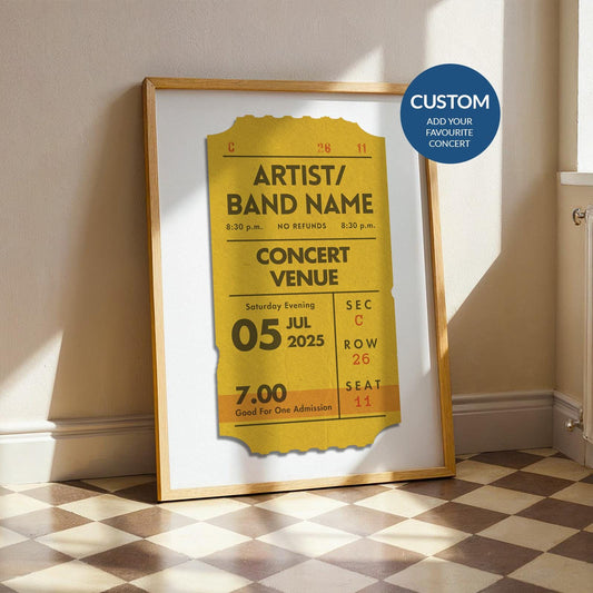 Framed personalised festival ticket print in mustard, bespoke vintage print leaning on wall.