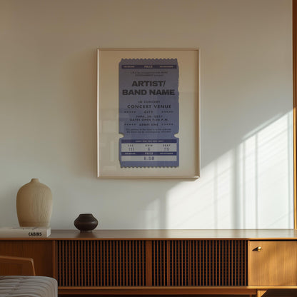 Personalised framed ticket print in cool blue, bespoke concert poster leaning on wall.