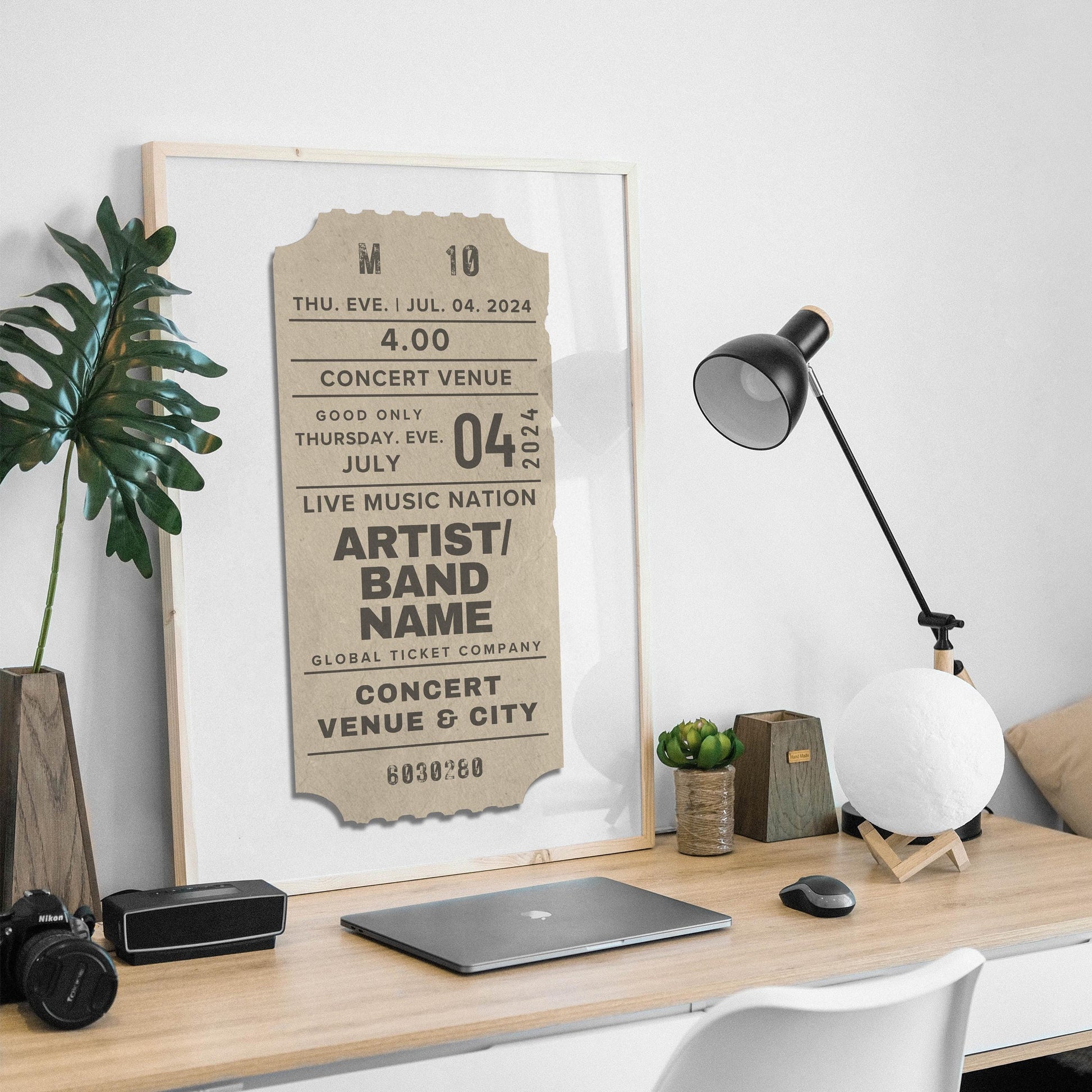 Framed cream ticket art, single custom concert print, resting casually on a shelf.