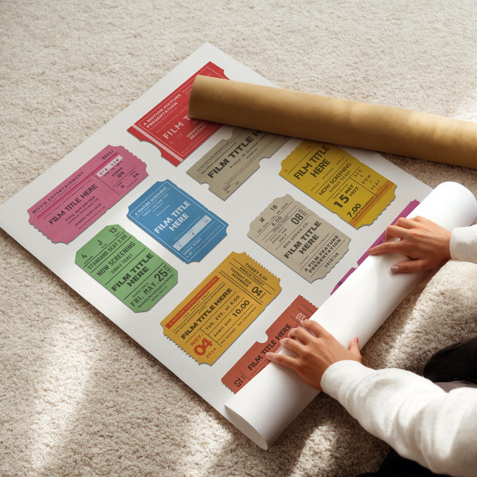 colourful poster being rolled up on floor. unique bespoke made design featuring favourite films.