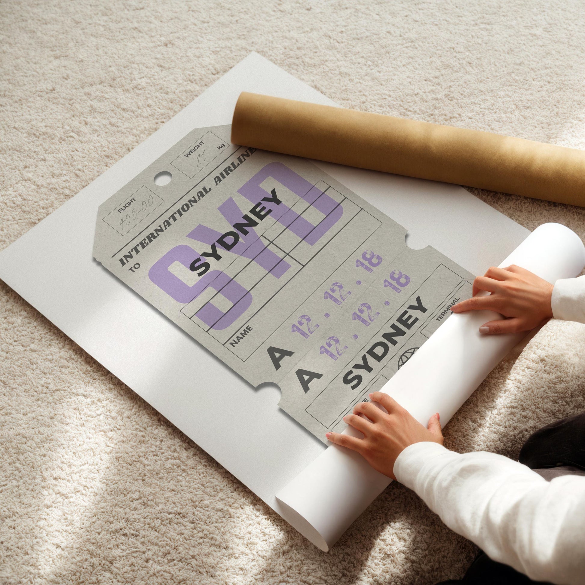 someone rolling up a vintage style poster of a retro luggage tag with custom travel details on it