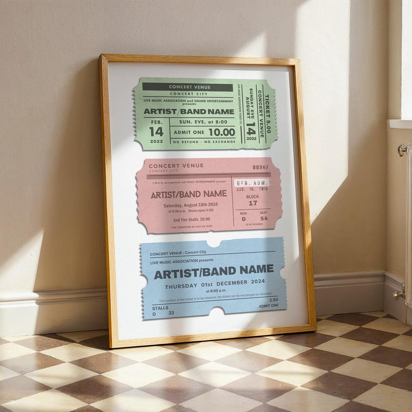 a wooden framed poster leaning on wall in kitchen. Set of 3 old concert stubs custom to your events.