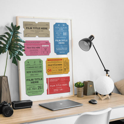 a manly desk setup at home with old ticket stubs art framed on wall.