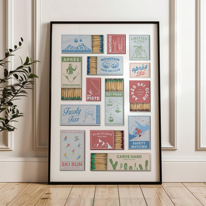 A perfect gift idea print showcasing vintage matchbox designs with snowboard resort themes. The boxes feature text such as "Grizzly Slopes" and "Carve Hard." The color scheme includes blues, reds, and greens, giving a retro feel.