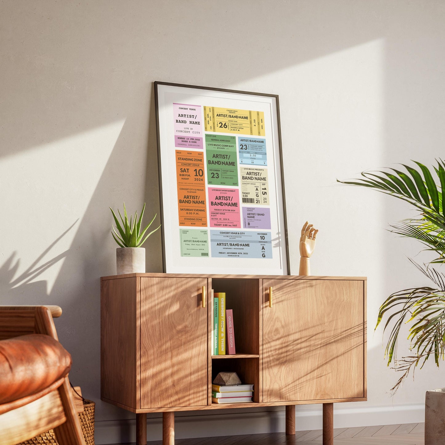minimalist house apartment with wood cabinet and plant in living room. Poster on counter with various colours inspired by event stubs from 80's and 90's