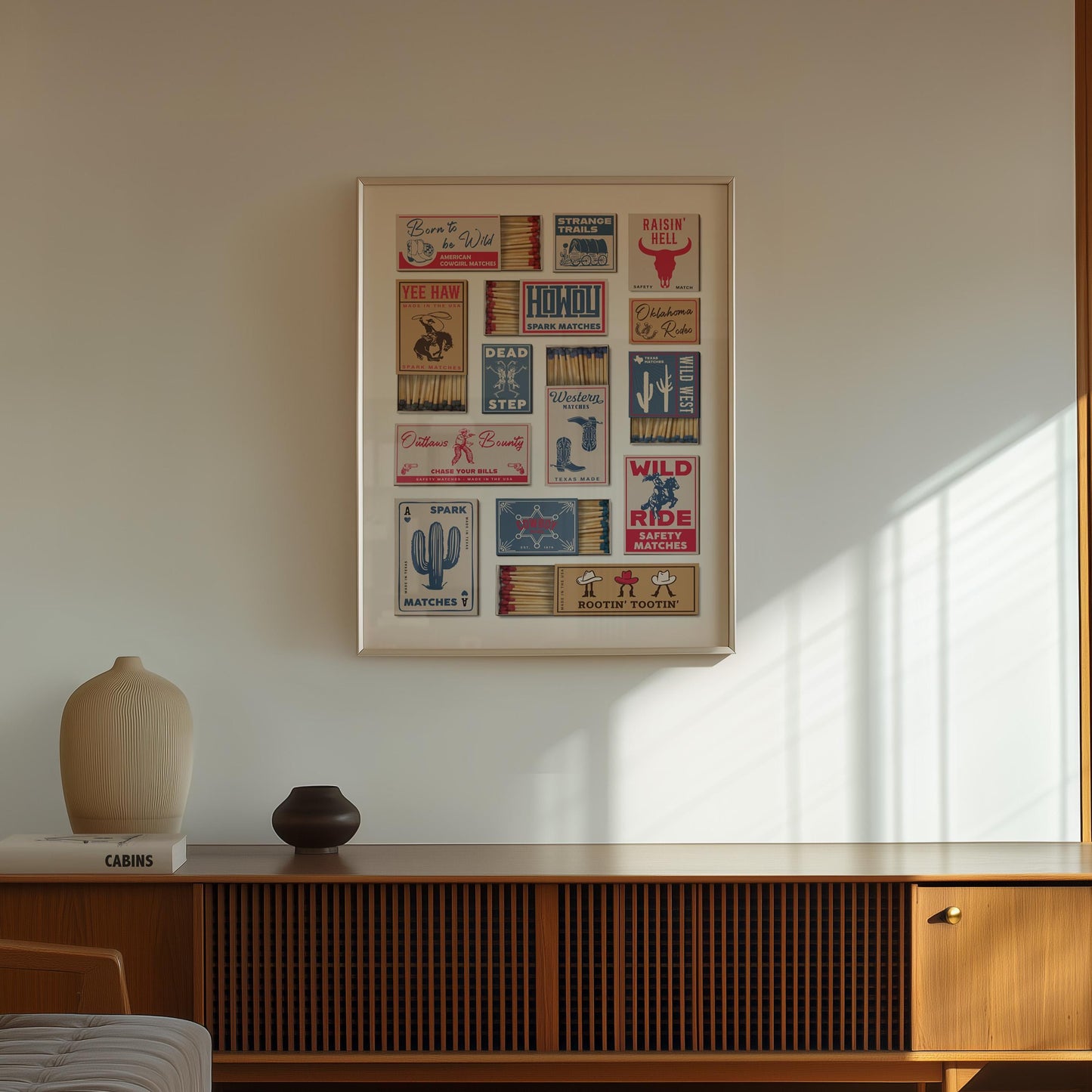 A rustic poster displaying vintage matchbox labels with a Western theme. The labels feature text such as "Dead Step" and "Wild West" alongside illustrations of desert and a bull. The frame is a light colour.