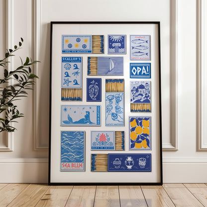 Art print showcasing matchbox designs with blue and yellow illustrations. Designs include a vase, shells, and text reading "SEA BLUE". The matches are visible within the boxes, creating a decorative display.