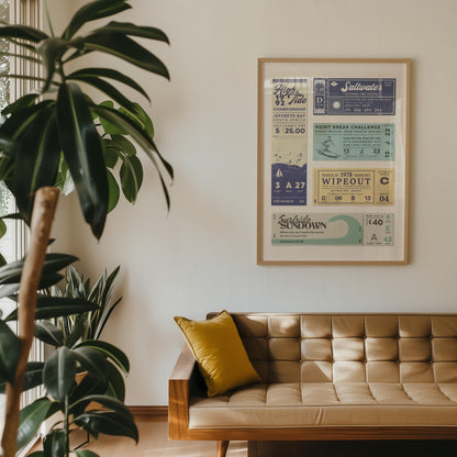 a 70's style home lounge with a ticket stub display poster on the wall for various surfing and beach events.