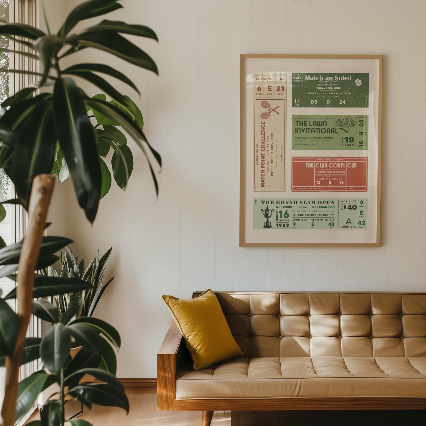 a retro living room in a flat with a vintage Tennis Club Ticket Stub Poster in green, clay, rich cream and white on the wall above a leather sofa.