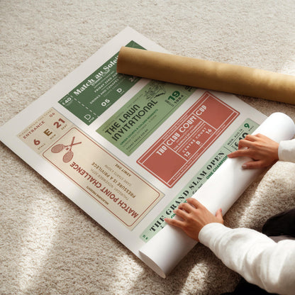 A trendy dopamine style print being rolled out on the carpet of a modern home. The print features posh and rich old money motif sport event invites and stubs.