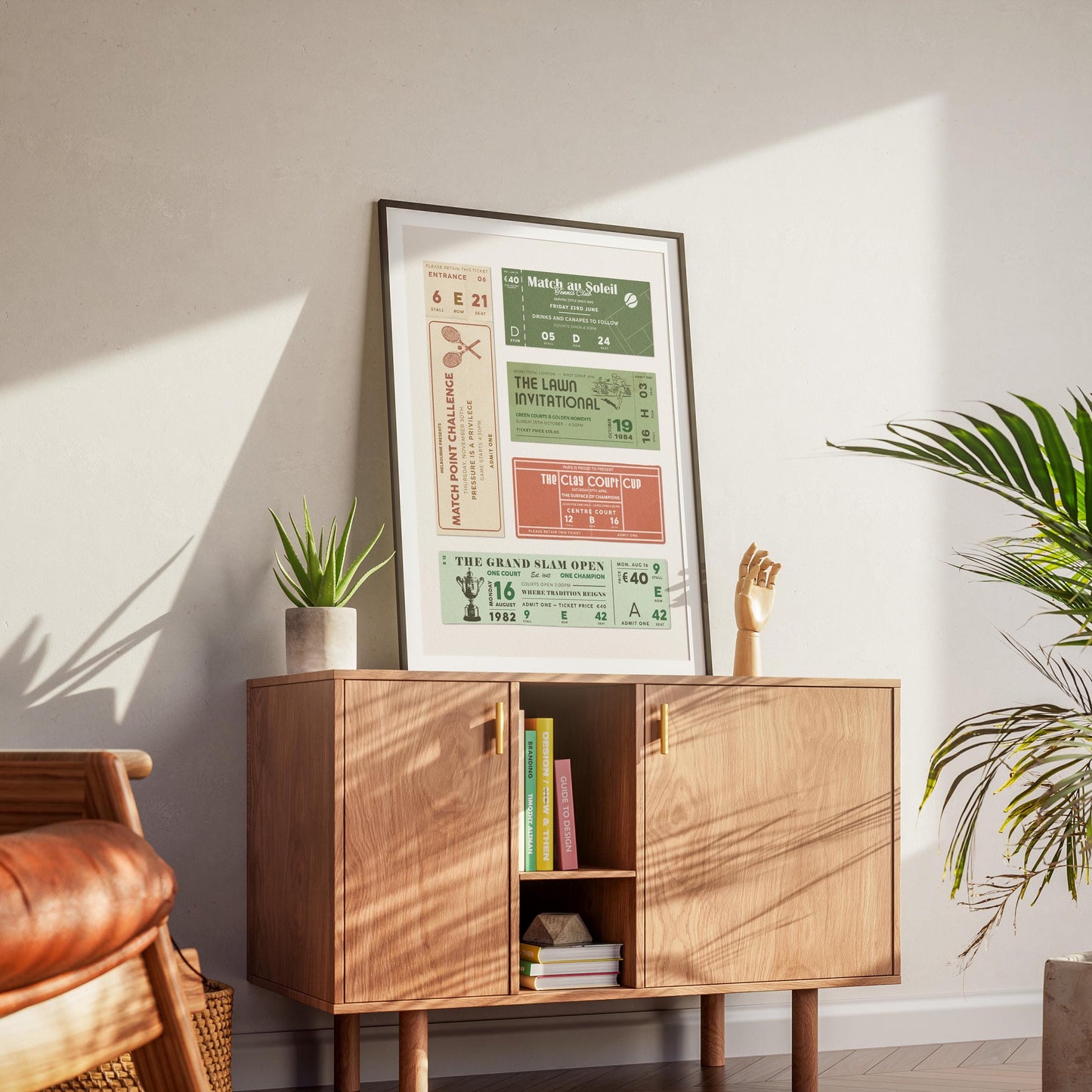 a modern dorm with wood furniture and a black framed poster featuring retro ticket stubs with tennis club and social motifs.