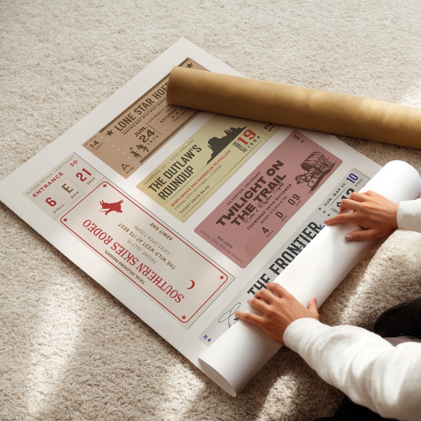 trendy aesthetic printable cowboy and cowgirl art being rolled out on a cozy carpet.