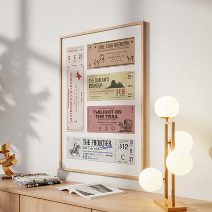 Country ranch poster in a girly apartment with light wood furniture. The art has yellow, beige, red, yellow and orange elements with a cowboy on a horse with a lasso and southern folk dancing in a hoedown.