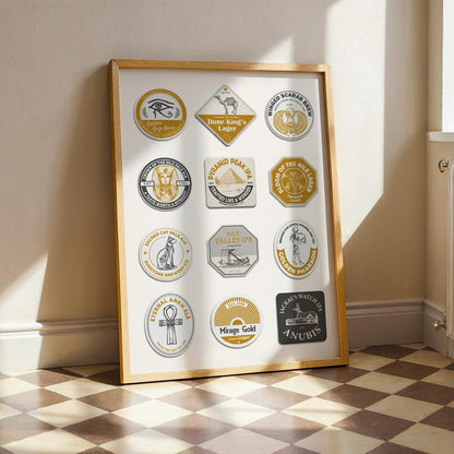 A print in a wood frame leaning on a white wall. The poster has custom made beer mats with egyptian motifs. Yellow and Blue colours with various symbols and icons such as the pyramids and camels.