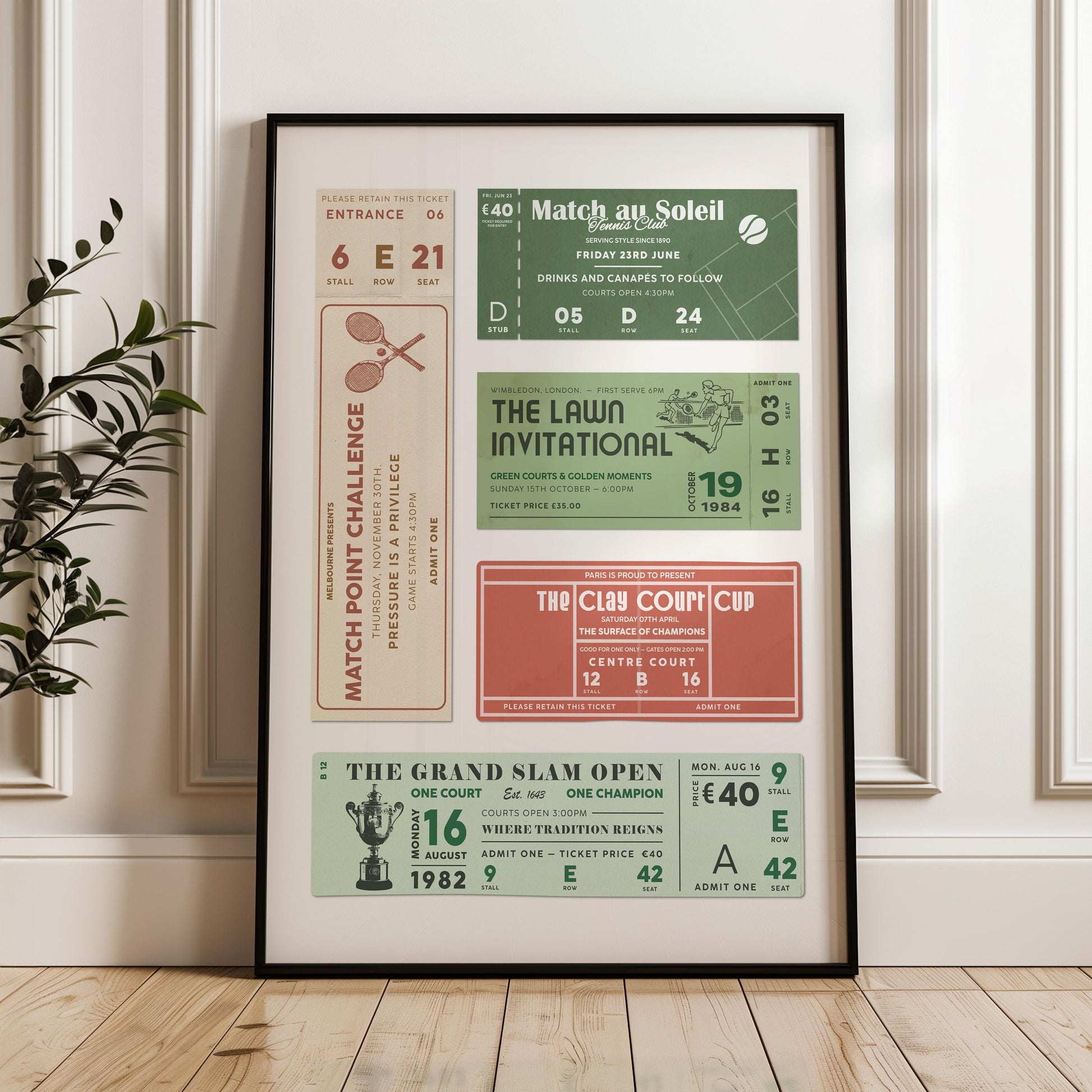 A home decor piece leaning on a white cladded wall. It is a green, clay and beige coloured event pass ticket art.