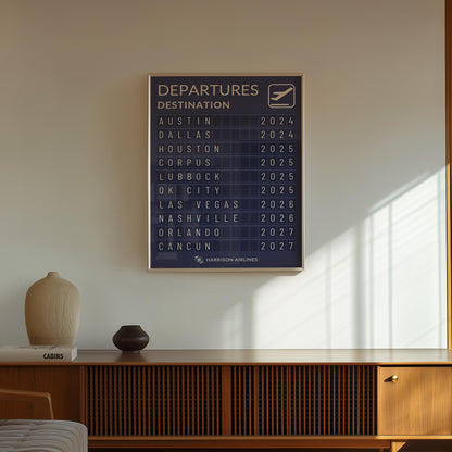 A mid century modern home with a framed nostalgic travel print with airport board design for adventurers and travel memory decor.