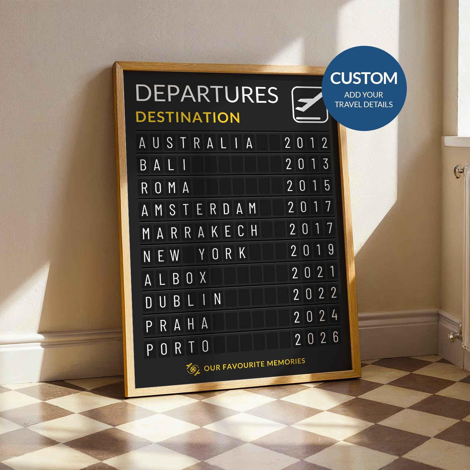A bright kitchen space with a funky floor and a poster framed in wood leaning on the wall in the sun. The print is made to look like a flights board in aviation with custom destinations and dates to be a personalised home piece or gift.