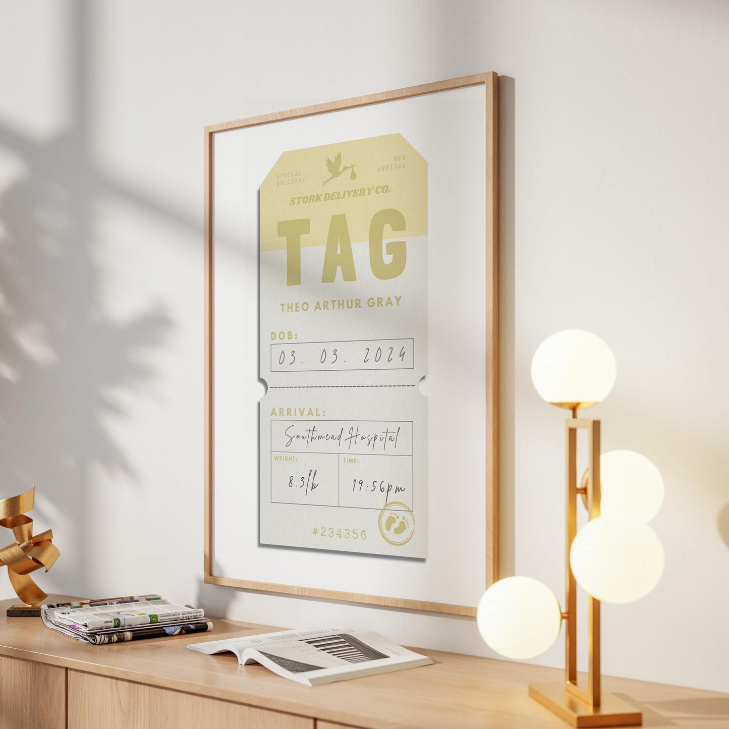 A modern home entryway with a large print on the wall showing a reto airport tag art with newborn stats on it.