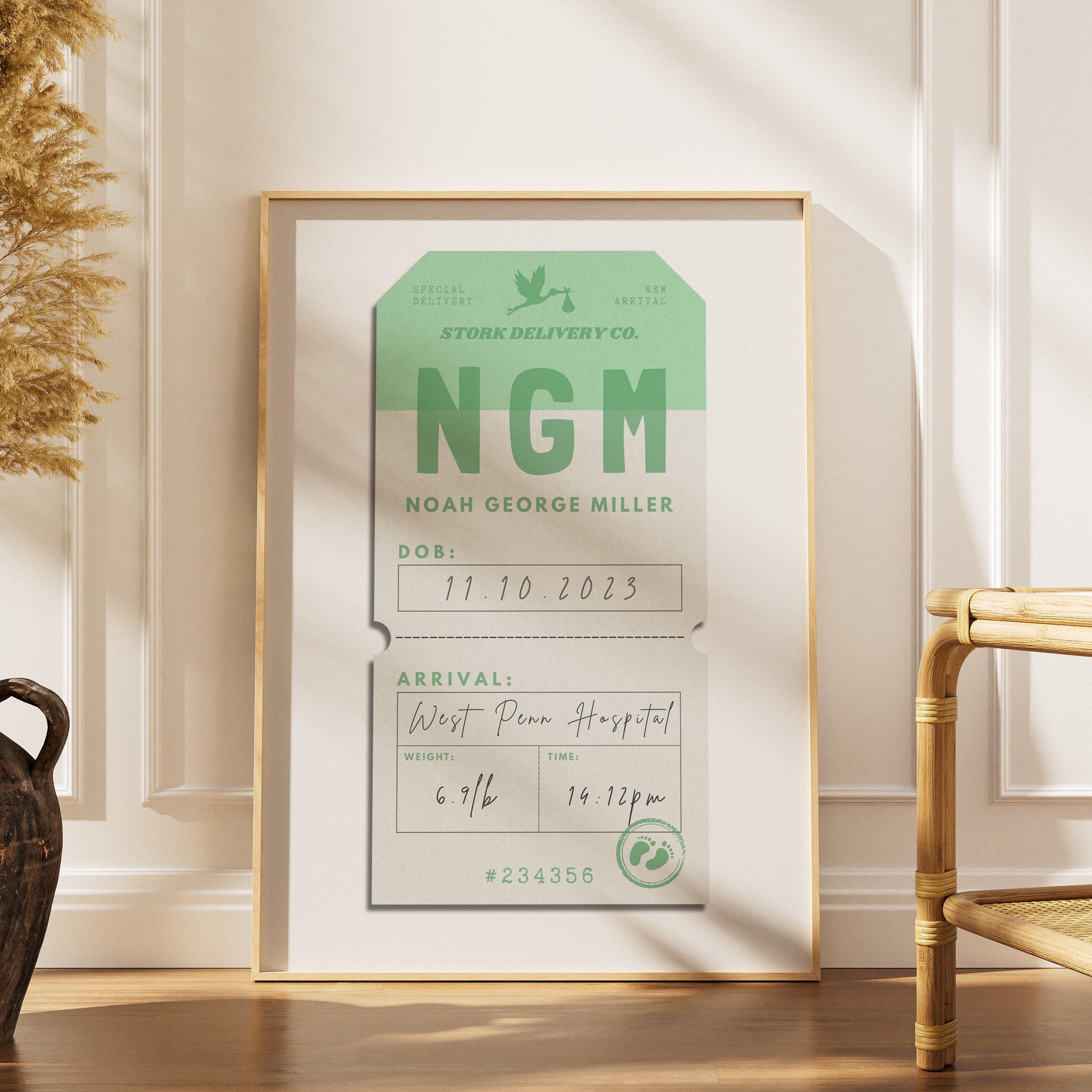 A boho scandi home interior with a print in a frame leaning on a white wall. The art is a vintage luggage tag design with first baby's name, weight, arrival time and more in script handwritten font. It is a unique custom gift for new mums.
