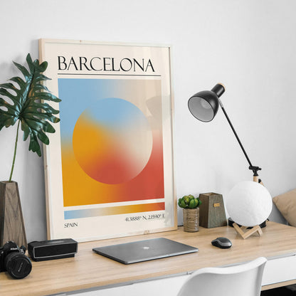 An abstract print is on a wooden desk, with a black desk lamp and a moon-shaped light in a masculine home office. The art gives a zen modern aesthetic.