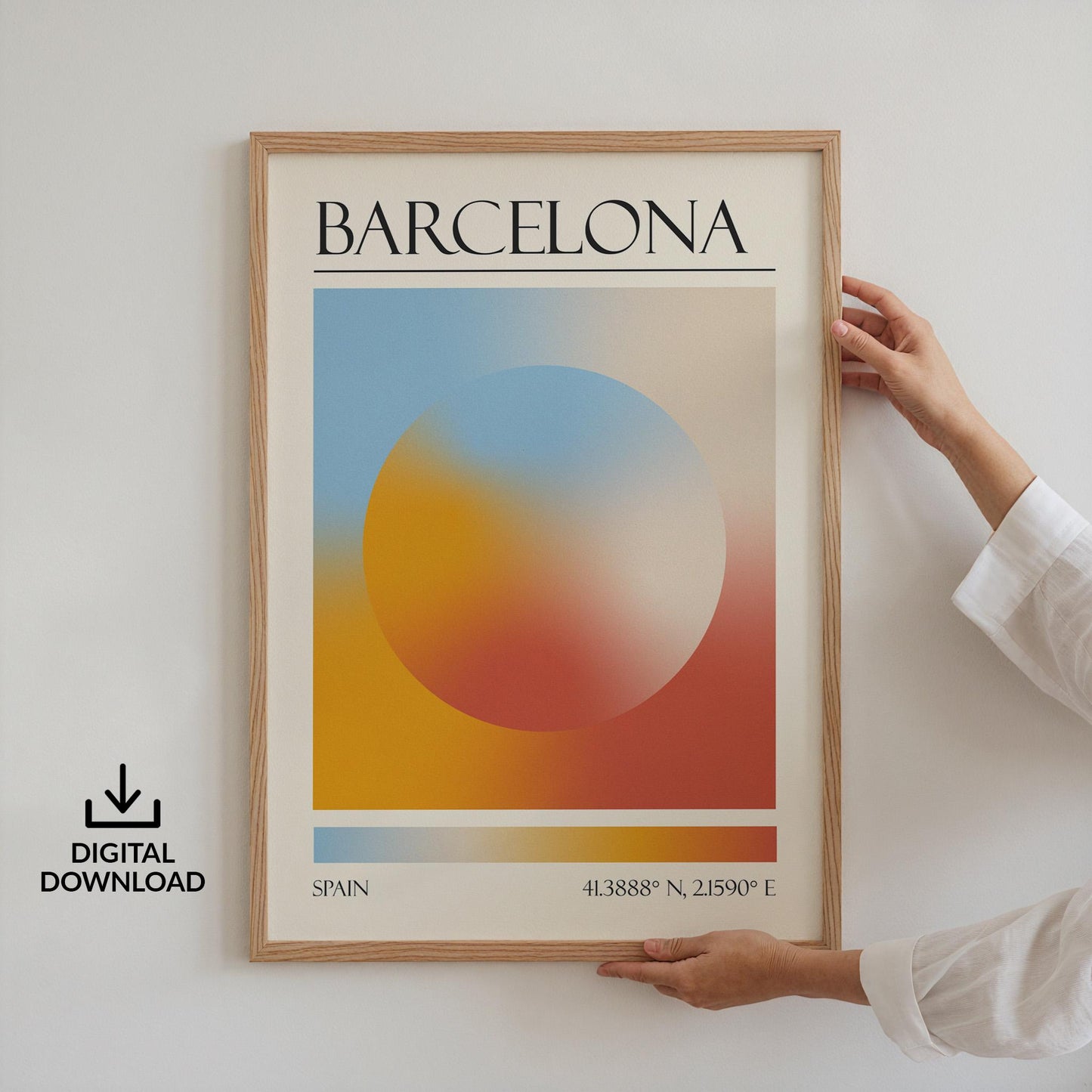 Someone in a white top holding up a framed print on the wall. The art is a destination travel poster inspired by spiritual aura colours inspired by the location such as Barcelona.