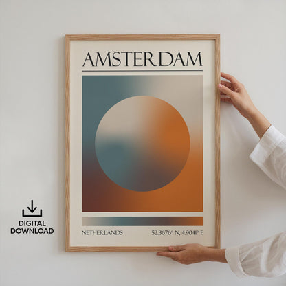 Someone in a white top holding up a framed print on the wall. The art is a destination travel poster inspired by spiritual aura colours inspired by the location such as Amsterdam.